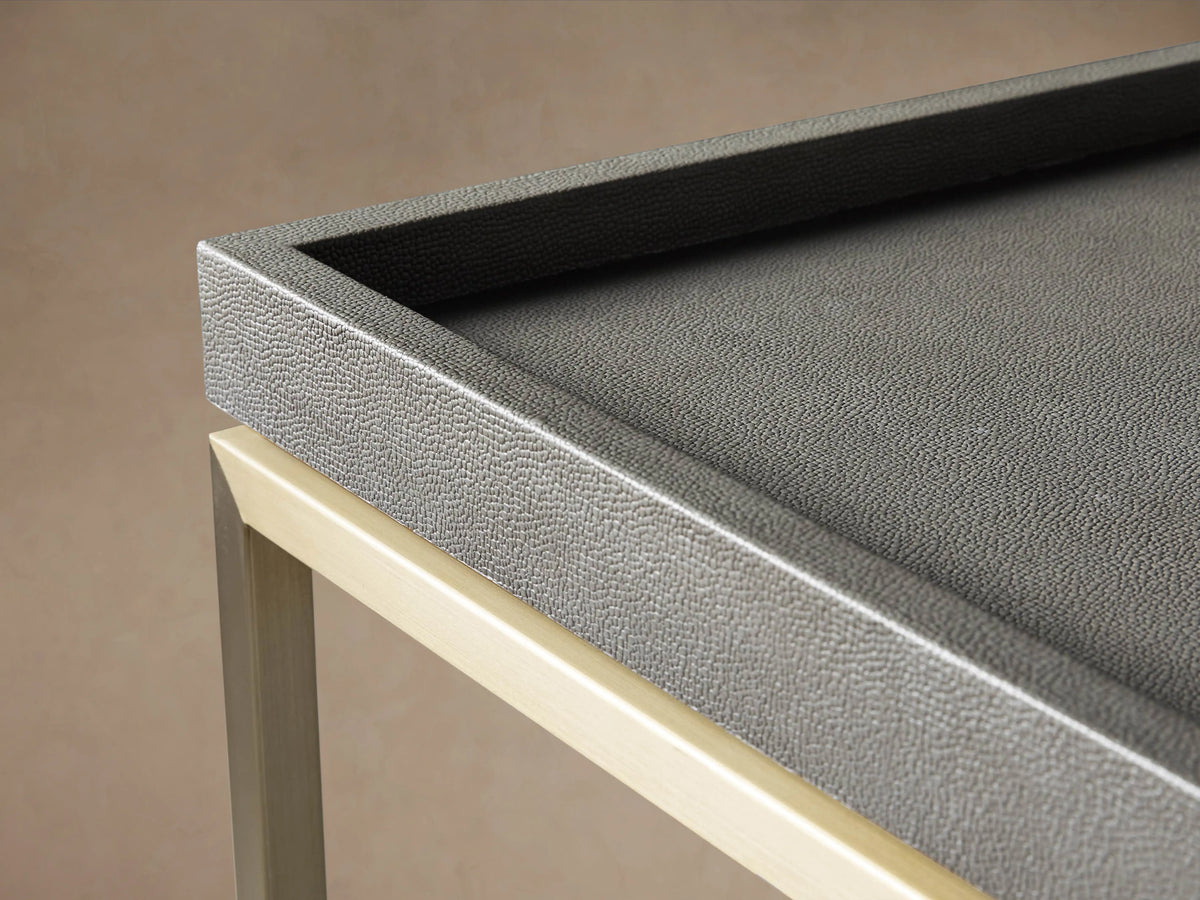 Malone Coffee Table corner, showcasing engineered hardwood top with shagreen pattern, set on a steel base with matching finish.