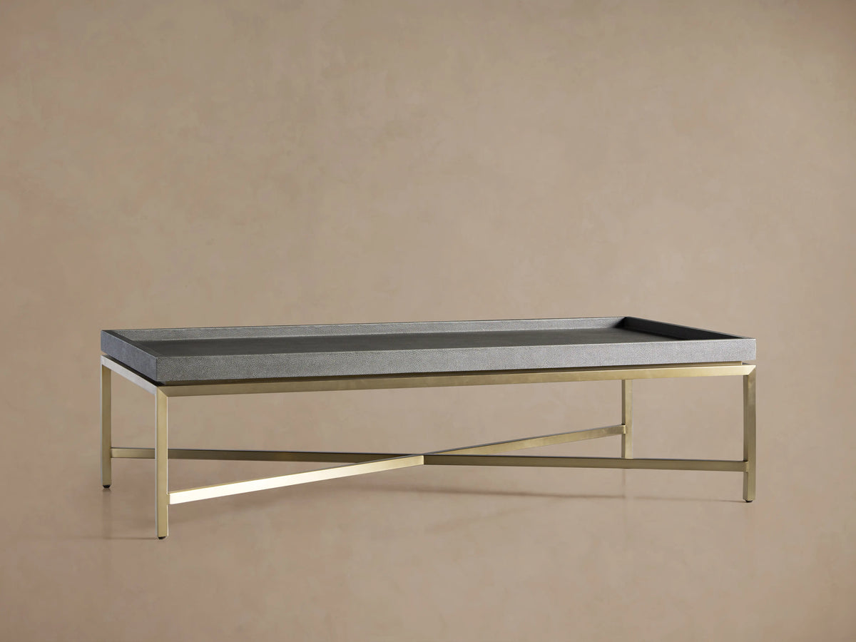 Malone Coffee Table with rectangular tabletop in grey shagreen-embossed leather finish, resting on a gold steel base.
