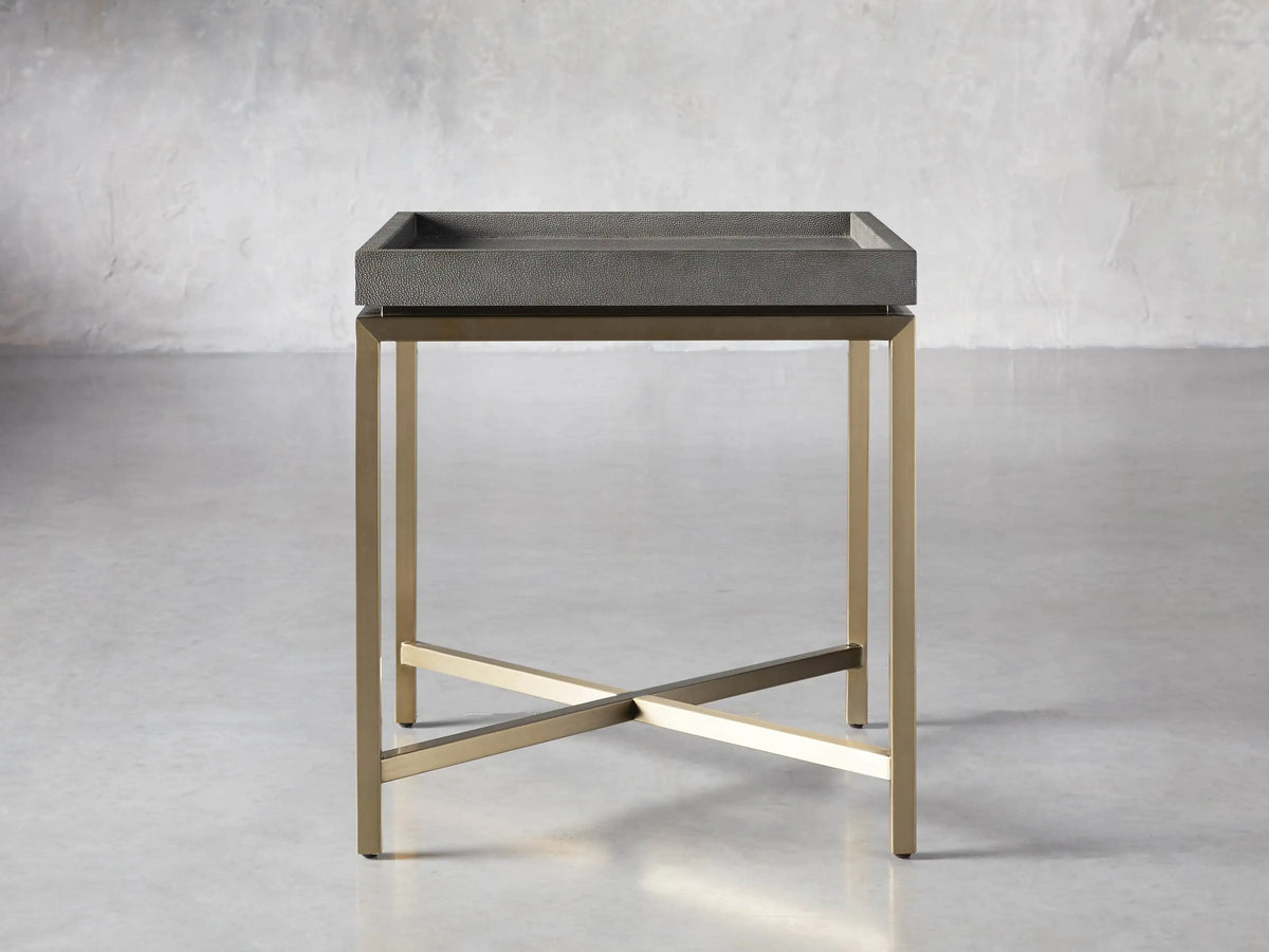 Malone End Table. Square dark gray shagreen leather-look top on a gold steel base with an X-shaped crossbar.