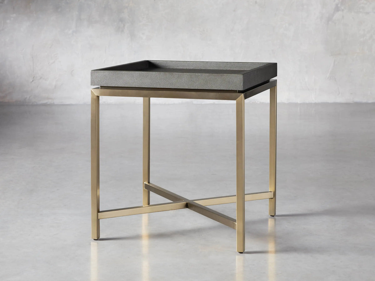 Malone End Table. Square dark gray shagreen leather-look top on a gold steel base with an X-shaped crossbar.