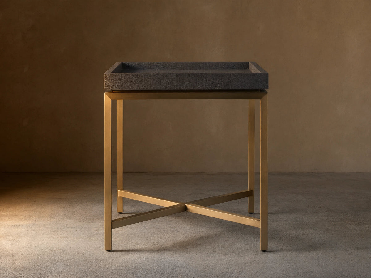 Malone End Table. Square dark gray shagreen leather-look top on a gold steel base with an X-shaped crossbar.