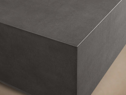 Malone Plinth Coffee Table with a rectangular dark shagreen-patterned tabletop on a neutral background. Top view.