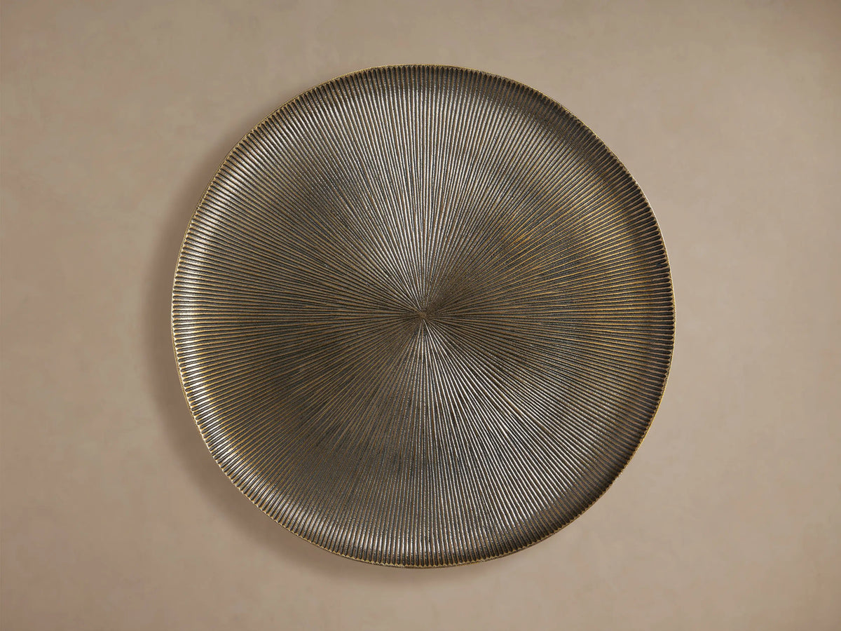 Manhattan Martini Table: Angled view of its round, dark bronze textured tabletop with radiating grooves and white-washed accents.
