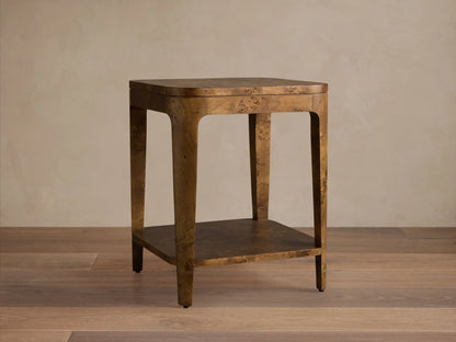 Front view of the Mogadore End Table with rich brown mappa burl veneer, featuring a top surface and an inset lower shelf.