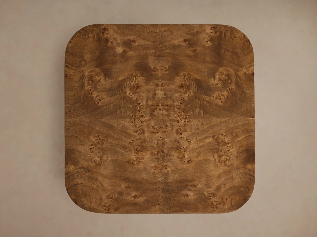 Front view of the Mogadore End Table with rich brown mappa burl veneer, featuring a top surface and an inset lower shelf.