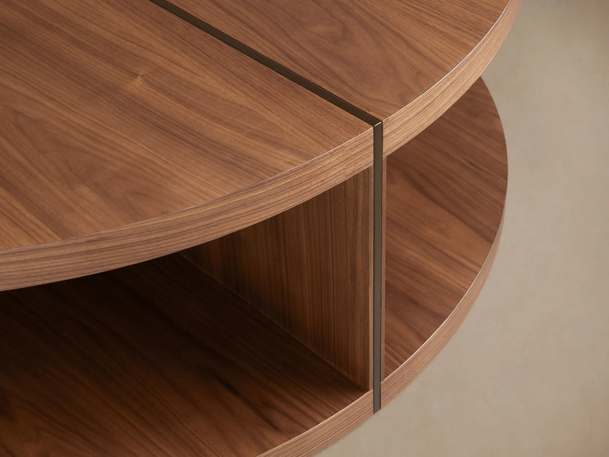 Round coffee table with a smooth wooden surface and two-tier design. Made of Romanian oak with visible wood grain and a central divider.