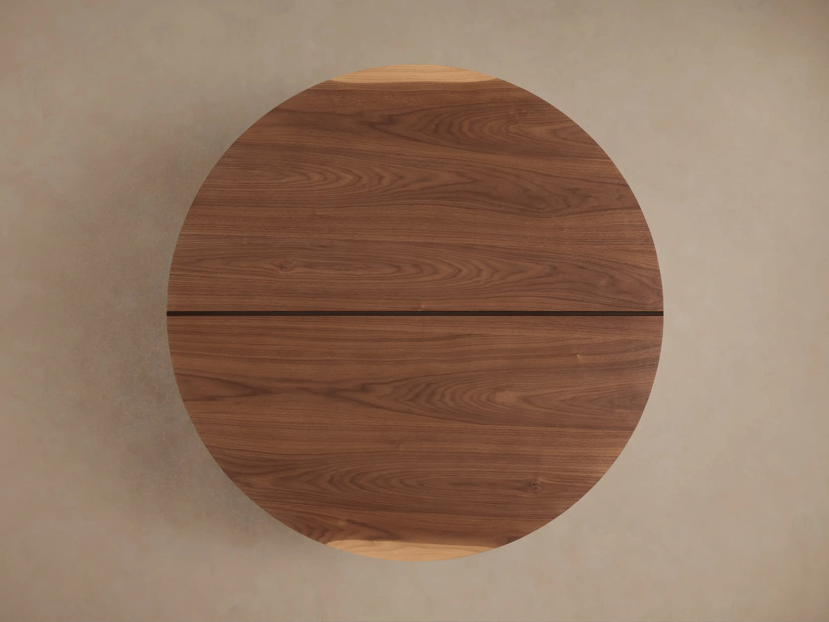 Mihaela Round Coffee Table in Romanian oak with visible wood grain, featuring metallic brass accents and multi-level design.