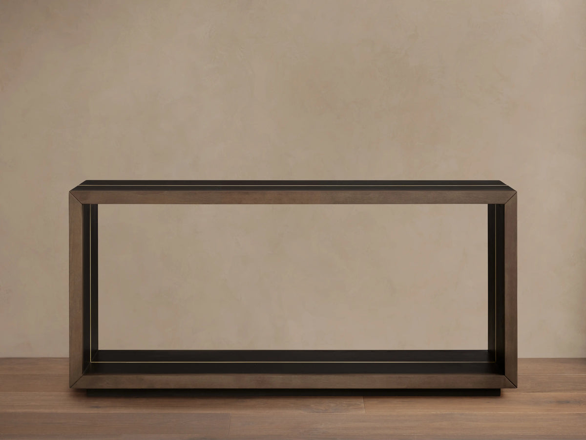 Mihaela Console Table in dark wood finish, rectangular shape, minimalist design, framed edges, against beige background.