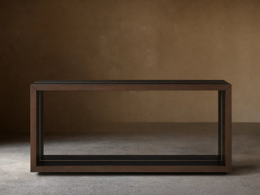 Mihaela Console Table in dark wood finish, rectangular shape, minimalist design, framed edges, against beige background.