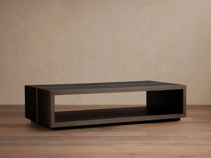 Mihaela Coffee Table in dark finish showing rectangular design, open shelf, on light wood floor; sleek, minimalist style.