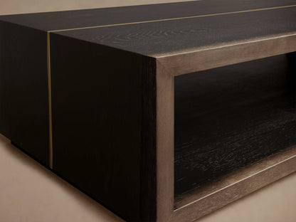 Mihaela Coffee Table with a dark wooden finish and metallic brass-like accents, showcasing a rectangular open compartment.