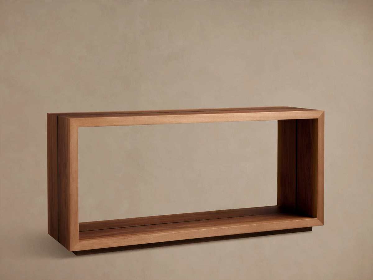 Mihaela Console Table made of Romanian oak with a natural finish, featuring a minimalist design. A vase and books are on top.