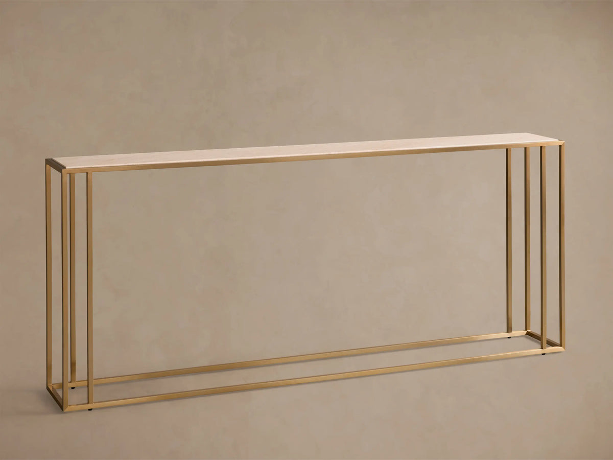 Front view of a long, rectangular Mills Stone Console Table with a light stone top and antique brass steel frame.