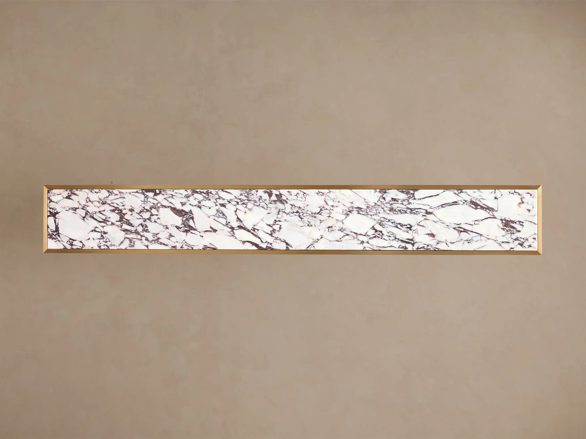 Front view of the Mills Stone Console Table with white marble top, grey veining, and antique brass-finish steel legs.