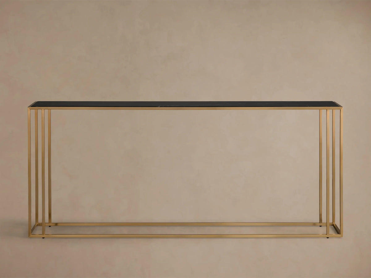 Front view of the Mills Stone Console Table with a black stone top and antique brass steel frame.