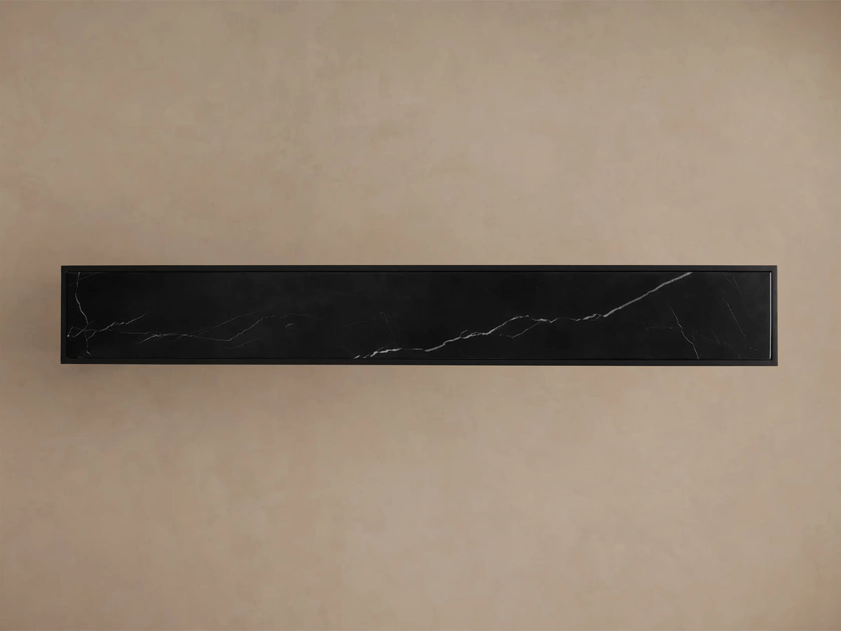 Front view of the black Mills Stone Console Table, featuring a black marble top with delicate white veining.