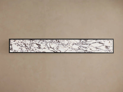 Close-up of the Mills Stone Console Table, showing the white marble top with dark veining and matte black steel frame.