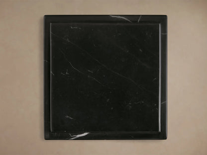 Group of three Black Marmont Pedestals with natural white marble veining. Rectangular forms with stepped, layered tops.