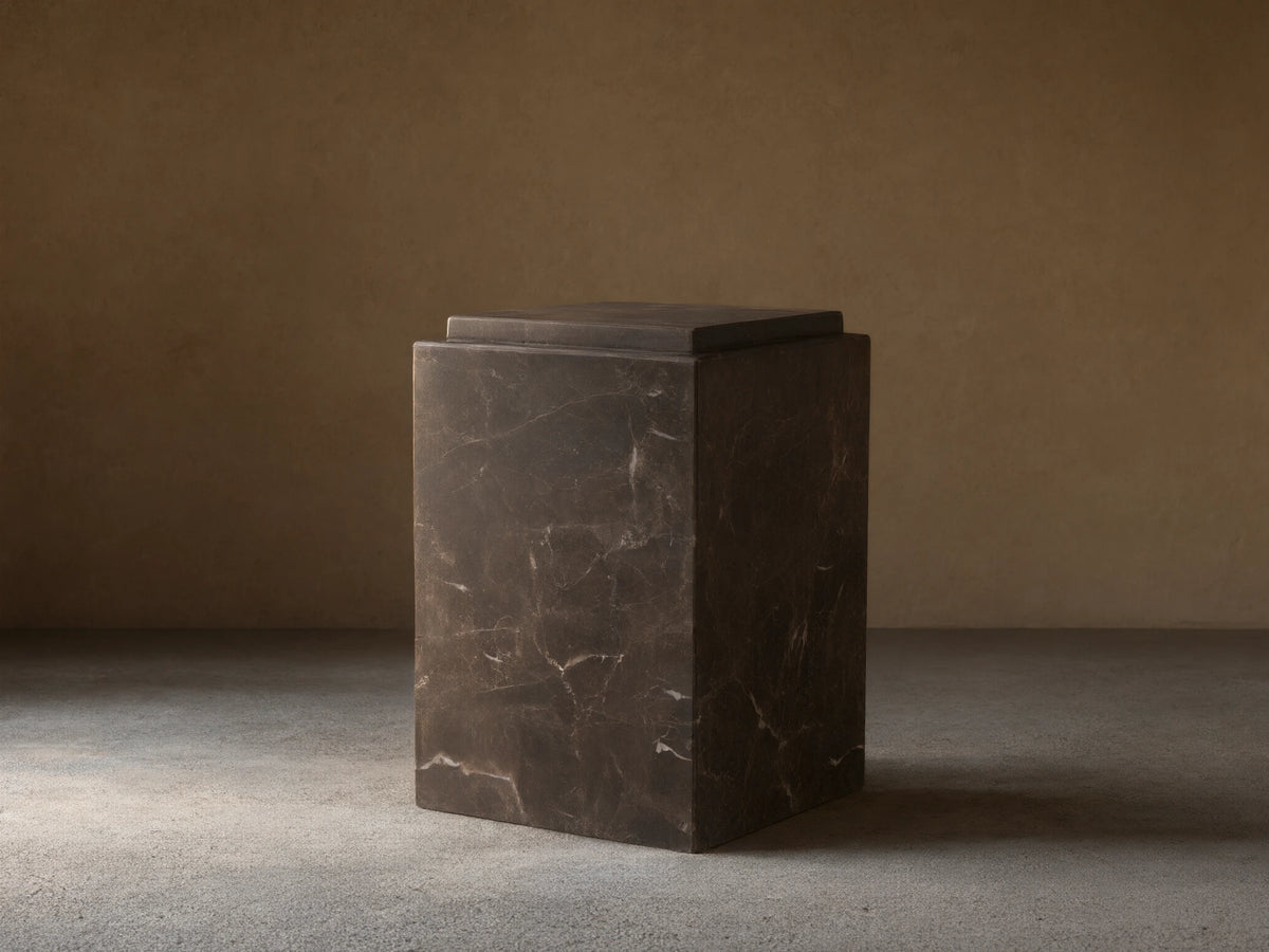 Handcrafted Marmont Pedestal made of natural dark marble with unique veining, matte lacquer finish, on a wooden floor.