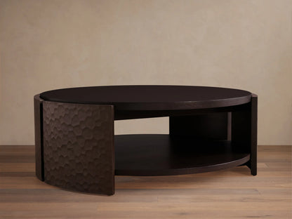 Dark mahogany chiseled round coffee table with two circular shelves and curved, textured side supports.