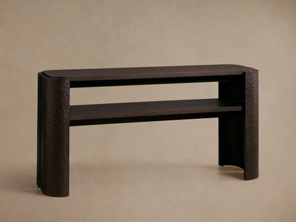 Close-up of a dark brown Chiseled Console Table corner, showing hand-carved chiseled texture on the mahogany wood leg.