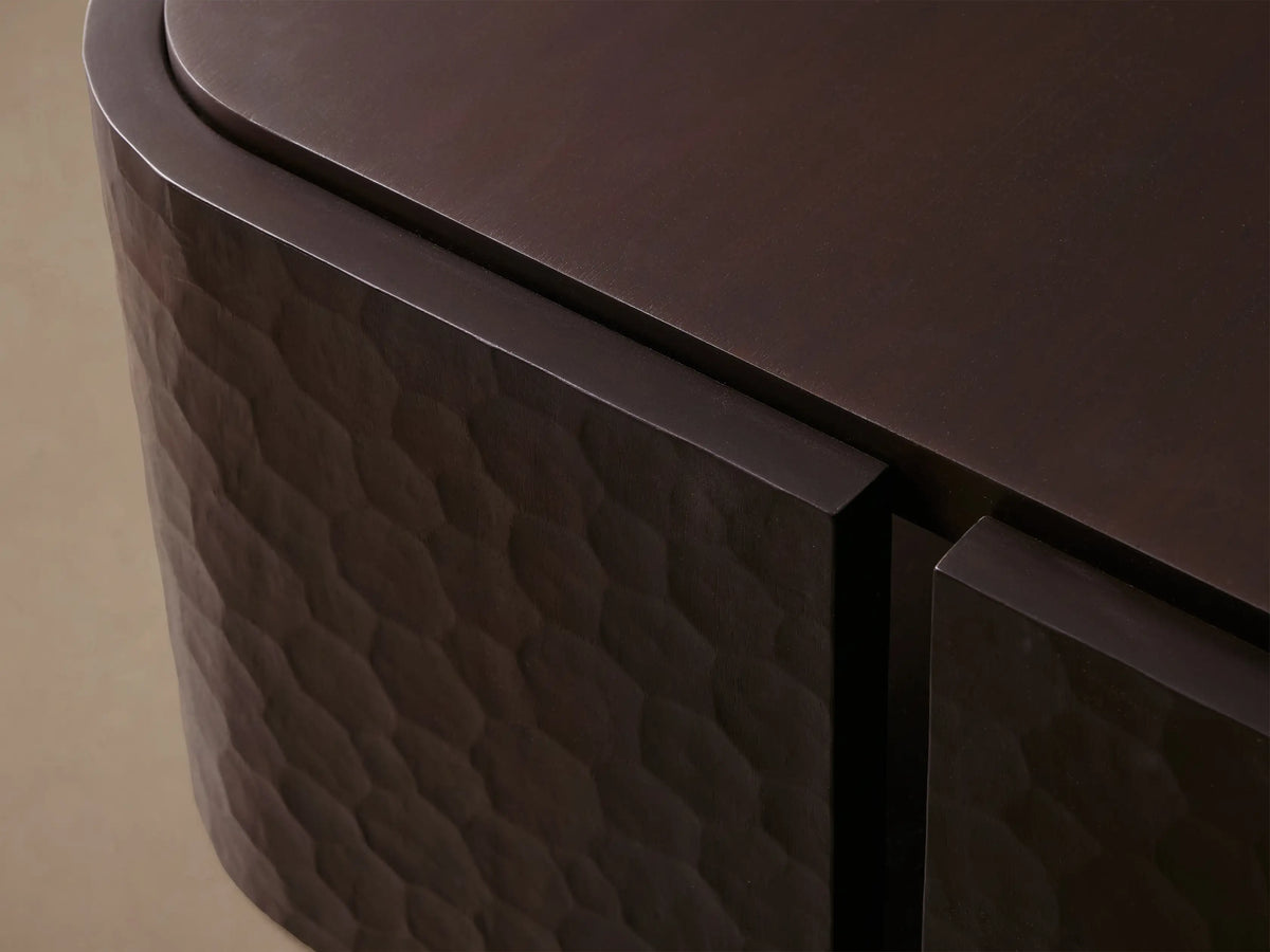 Dark mahogany chiseled coffee table with a rectangular top, lower shelf, and textured, hand-carved curved legs.