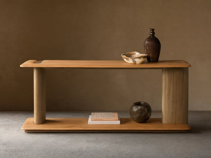 Front view of the Nolito Console Table. Two-toned wood, with light brown rounded shelves and darker curved supports.
