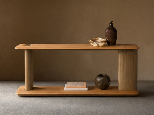Front view of the Nolito Console Table. Two-toned wood, with light brown rounded shelves and darker curved supports.