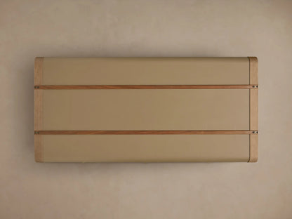 Front view of the olive Oberlin Storage Coffee Table, a trunk-style table with beige leather trim, a brass-tone lock, and wooden bands.