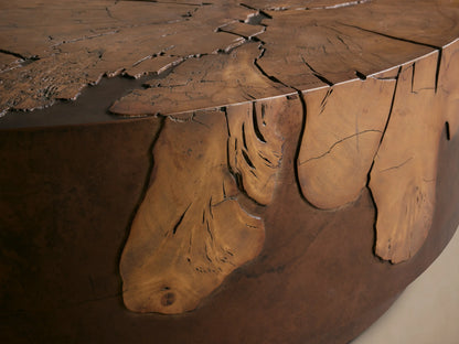 Obra Round Coffee Table with a natural milpa burl wood top, organic patterns, and coppery weathered steel sides.