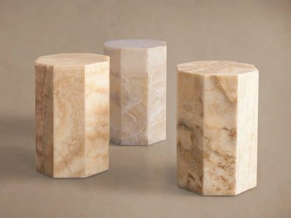 Odelia Onyx Stool: overhead view of an octagonal, honed solid onyx top with natural ivory and beige color variations.