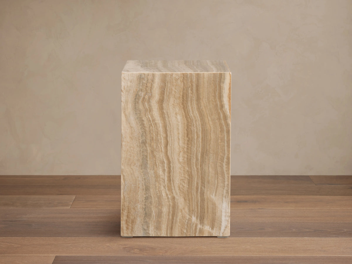 Grey Onyx Stool, rectangular block, wavy natural stone patterns in earthy brown, tan, yellow, and subtle grey.