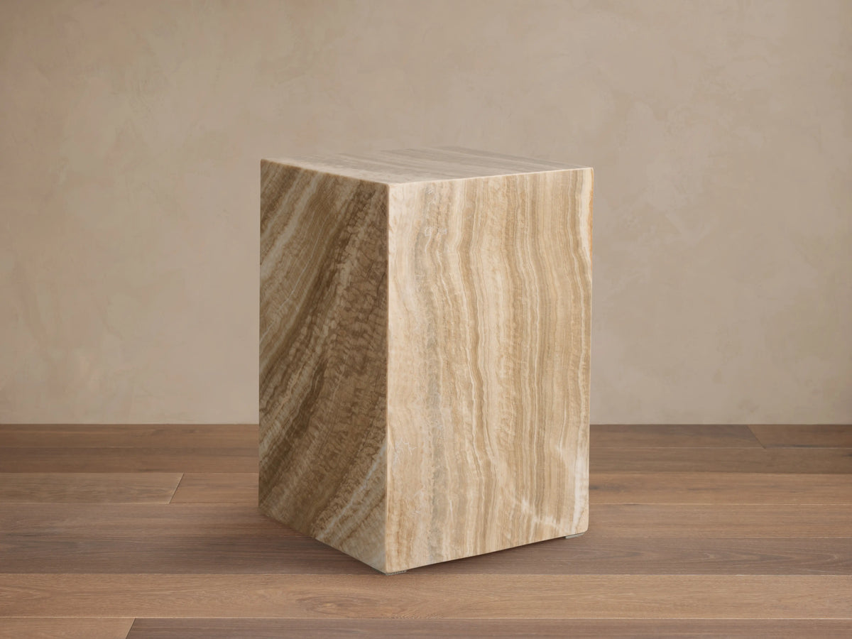 Grey Onyx Stool, rectangular block, wavy natural stone patterns in earthy brown, tan, yellow, and subtle grey.
