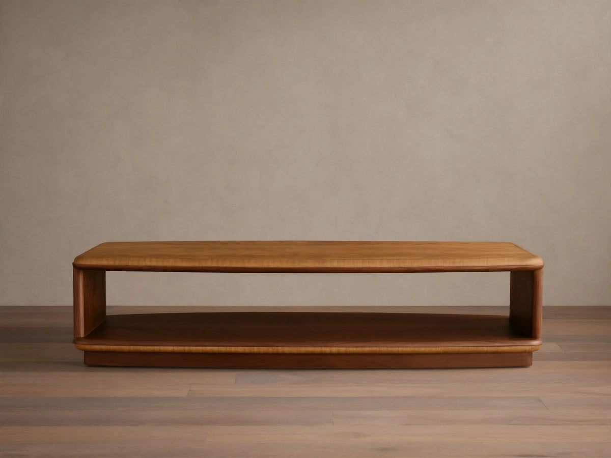 Front view of the two-tiered Palma Coffee Table with a golden brown cerajeira wood veneer top and darker mahogany base.