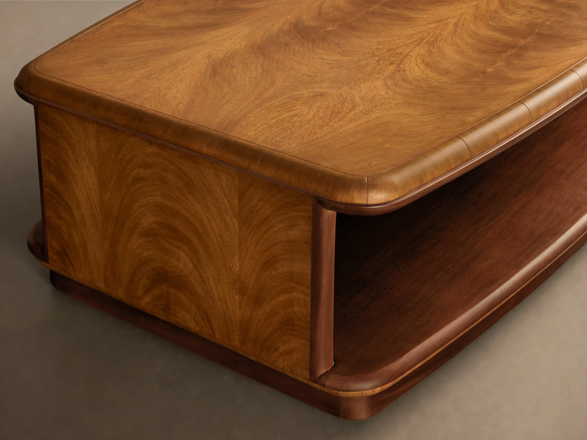 Front view of the Palma Coffee Table, a two-tier rectangular table with a light brown cerajeira wood veneer top and a dark brown mahogany base.