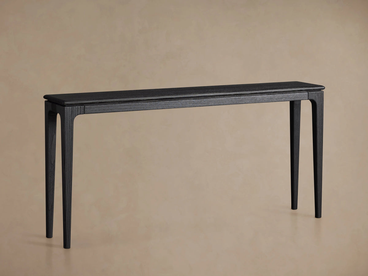 Park Console Table with a sleek design in rich ebony finish, rectangular top, four tapered legs, on wooden floor.