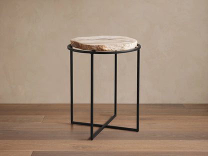 Front view of the Wood Slice Side Table, featuring a round, natural-edge wood slice top and a black metal cross-base.