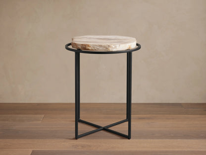 Front view of the Wood Slice Side Table, featuring a round, natural-edge wood slice top and a black metal cross-base.