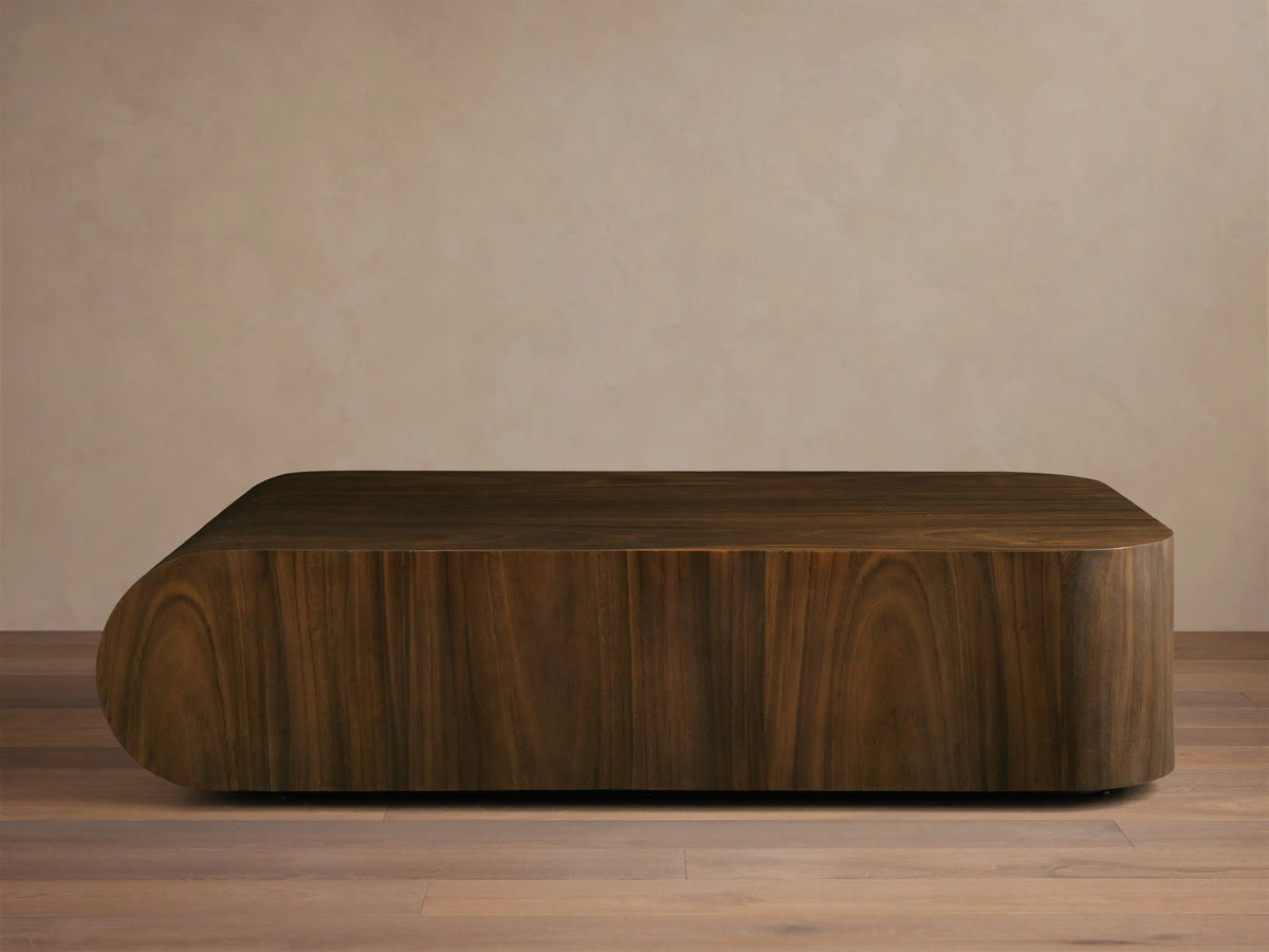 Front view of a dark wood coffee table with rounded ends and visible wood grain.