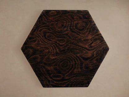 Dark brown Redge Hexagonal Martini Table top, madrona burl veneer with swirling grain, viewed from above on a light background.