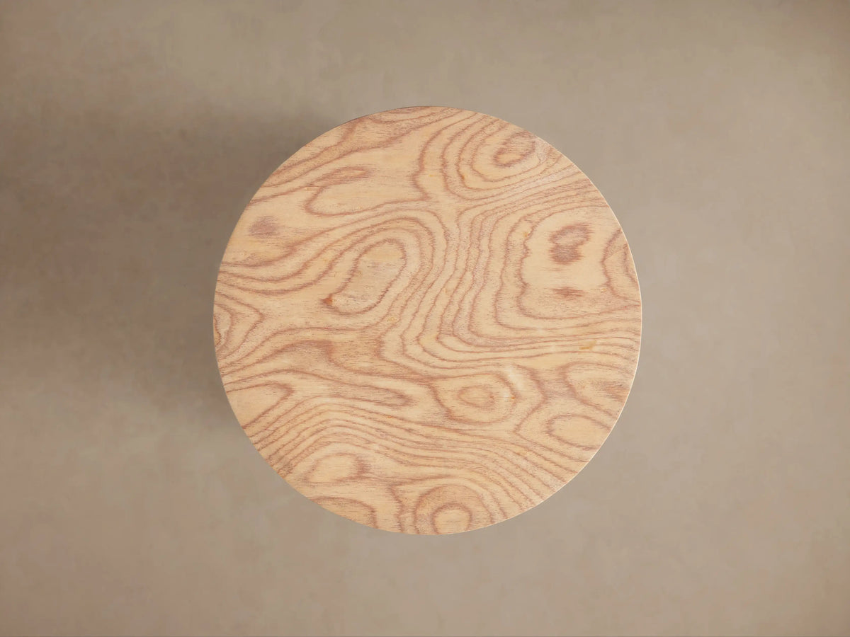 Redge Martini Table, round light wood with distinctive swirling madrona burl grain. Top surface and side visible.