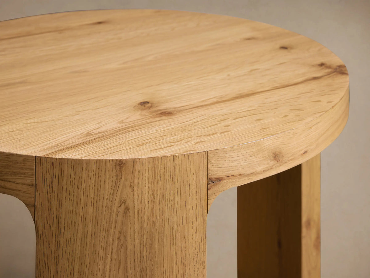 Front view of the Redding End Table, made from light natural white oak with a round top and a built-in lower shelf.