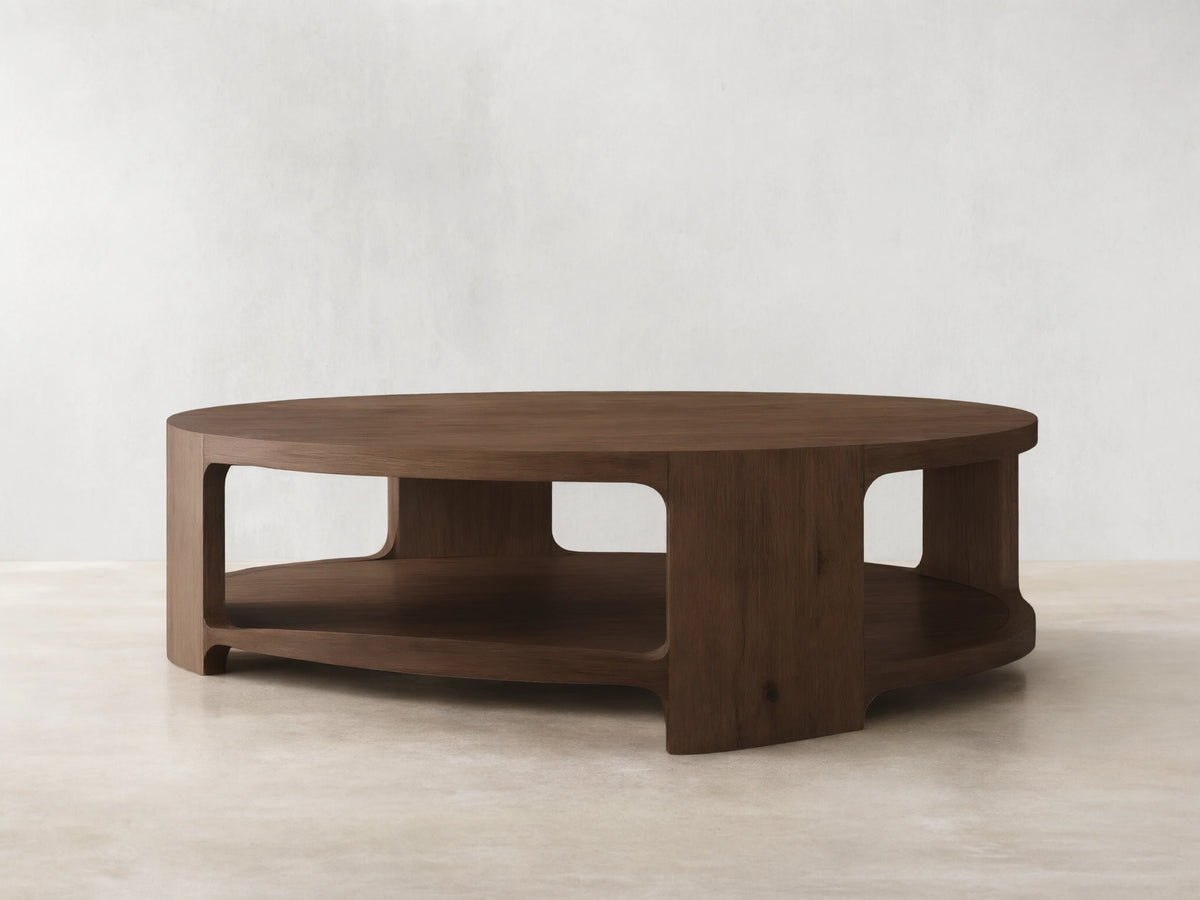 Front view of the Redding Round Coffee Table, a round table crafted from stained white oak, with a lower storage shelf.