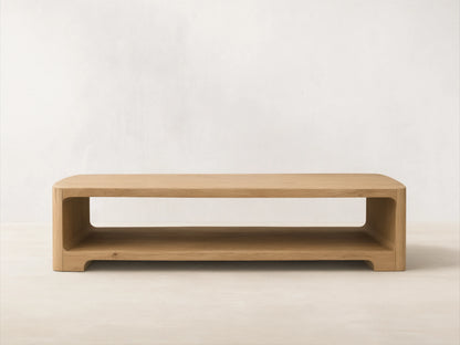 Front view of a light wood Redding Coffee Table, featuring rounded edges and a built-in lower shelf.