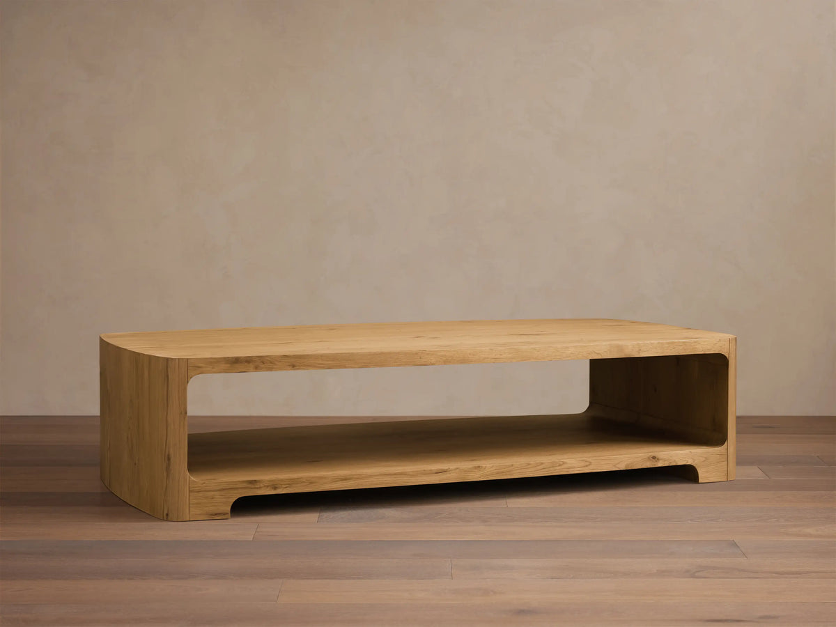 Close-up of the natural white oak Redding Coffee Table, highlighting its rounded edges, visible grain, and lower storage shelf.