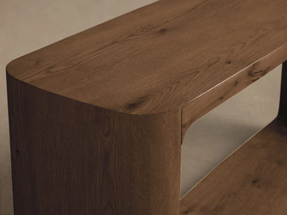 Close-up of the dark brown oak Redding Console Table, featuring rounded corners, prominent wood grain, and a visible lower shelf.