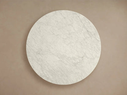 Top-down view of the white honed stone round tabletop with gray veining for the Saint Germain Round Stone Coffee Table with Rennes Base.
