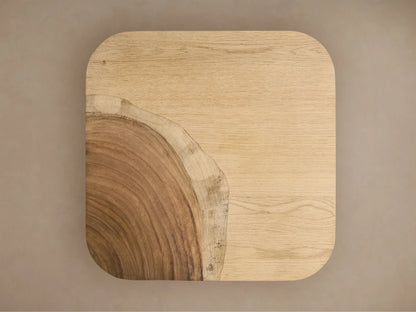 Front view of the Ramiro End Table, a cube-shaped table of natural American oak and Guanacaste wood with rounded edges and varied grains.