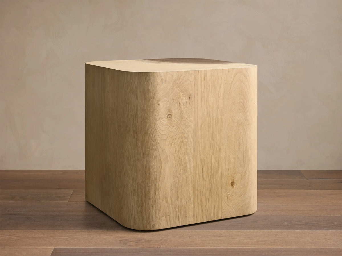 Front view of the Ramiro End Table, a light American oak wood square top with a quarter-circle dark Guanacaste wood inlay.