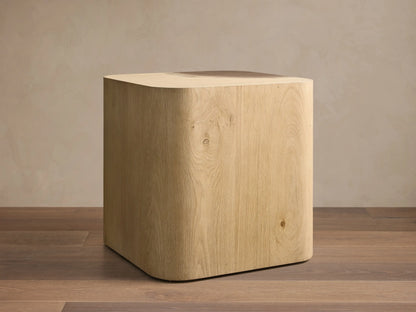 Front view of the Ramiro End Table, a light American oak wood square top with a quarter-circle dark Guanacaste wood inlay.